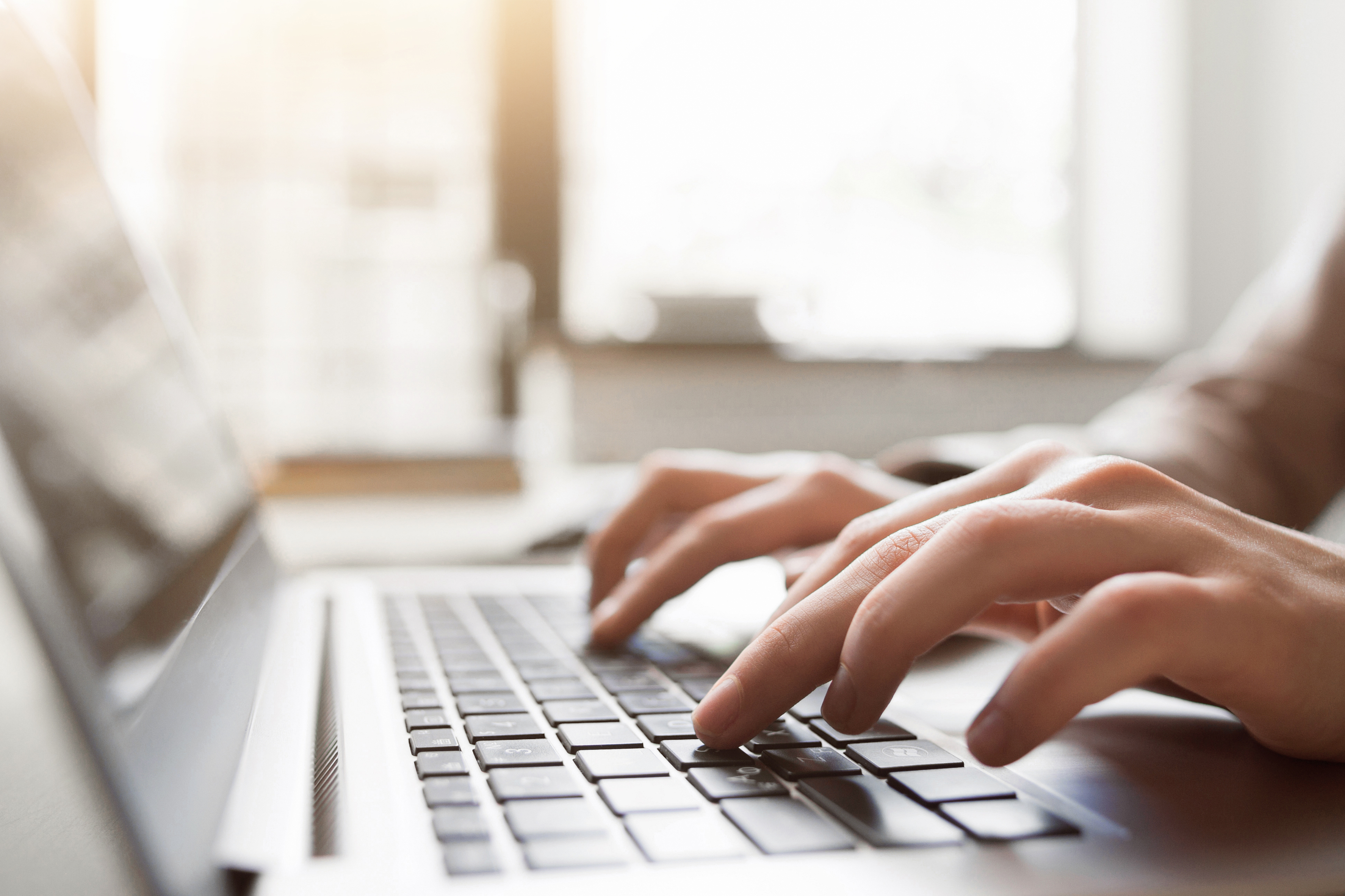 Person typing on computer