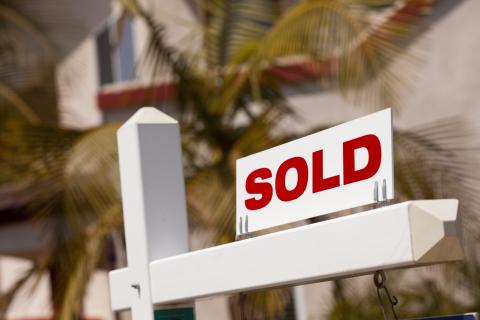 Sold sign in front of a house